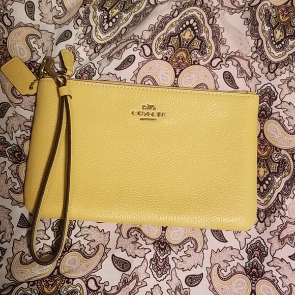 Coach Handbags - Coach sunflower yellow leather wristlet